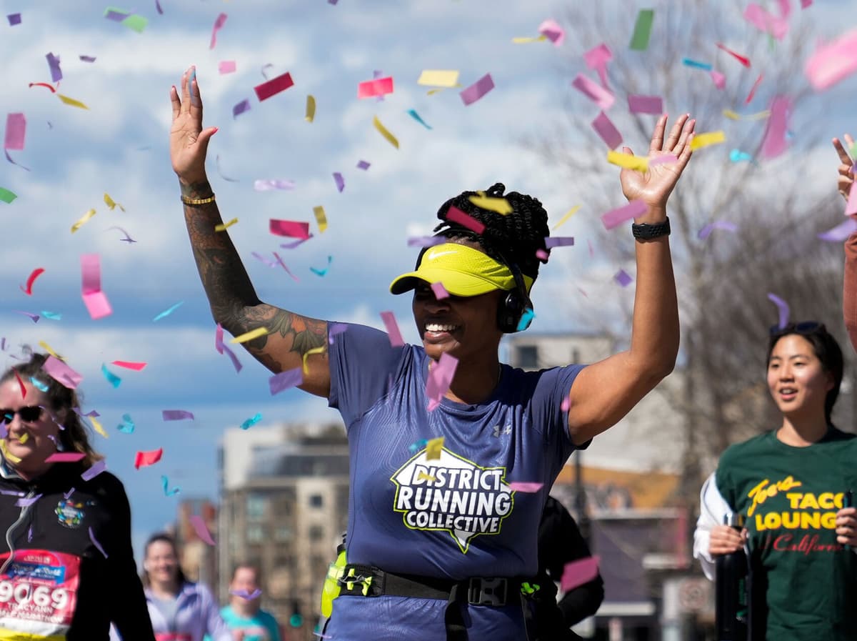 A runner celebrating with confetti